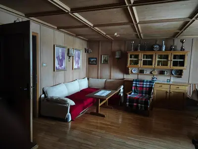 a living room with a couch and a table at Casa Rizzi in Campitello di Fassa