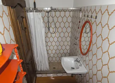 a bathroom with a sink and a mirror at Ca de Rupe in Chiave