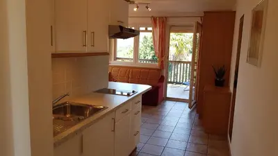 a kitchen with a sink and a counter top at Apartmenthaus am Waalweg in Caines