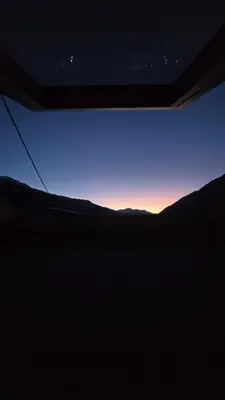 a view of the sunset from the window of a vehicle at Hike, Bike & More in Parcines
