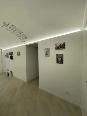 a room with pictures on the walls of a museum at Casa Tilì in Ziano di Fiemme