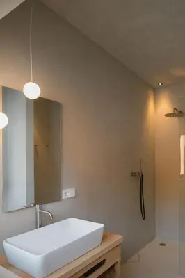 a bathroom with a white sink and a shower at Chalet Herol in Luson