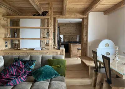 a living room with a couch and a table at Luxury apartment in Cortina in Cortina dʼAmpezzo