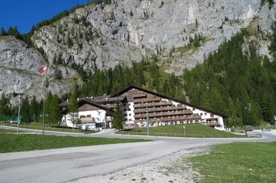 a large building in front of a mountain at Principe Marmolada 816 A in Malga Ciapela