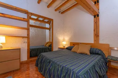 a bedroom with a bed and a mirror at Principe Marmolada 816 A in Malga Ciapela