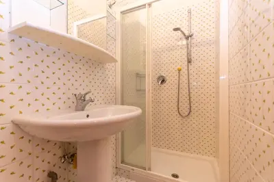 a bathroom with a sink and a shower at Principe Marmolada 816 A in Malga Ciapela