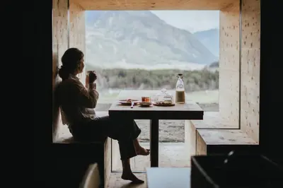 a woman in the water holding a wine glass at Brondstott Farm & Suites Kronplatz in Riscone