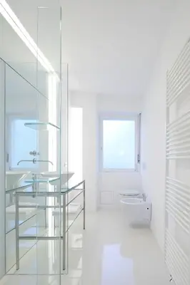 a bathroom with a glass sink and a toilet at MERANEA- sonnig - ruhig - elegant - ideal zum länger bleiben - Glasfaser in Merano