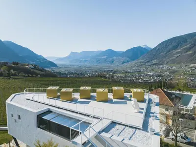 a house with a view of the mountains at Hotel Gartner in Tirolo