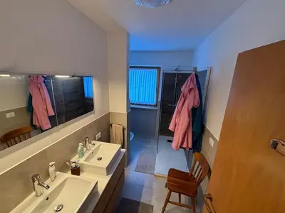 a bathroom with a sink and a mirror at Marmolada Escape in Malga Ciapela