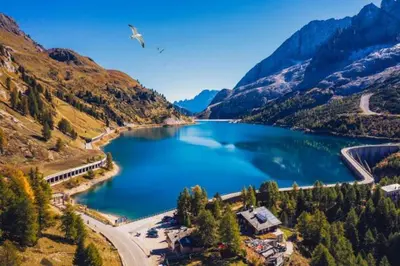 a lake in the middle of a mountain at Marmolada Escape in Malga Ciapela