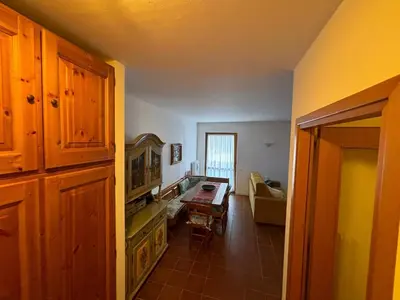 a living room with a couch and a table at Marmolada Escape in Malga Ciapela