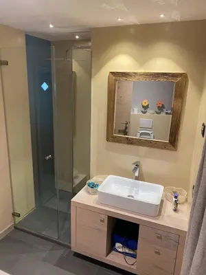 a bathroom with a sink and a shower at tabià piz meda in Moena