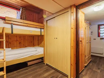 a bedroom with bunk beds in a cabin at Apartment Boiserie by Interhome in Campitello di Fassa
