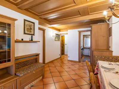 a dining room with a table and chairs at Apartment Corte dei Larici by Interhome in Campitello di Fassa