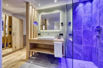 a bathroom with a sink and a shower at Brunelle Seiser Alm Lodge in Alpe di Siusi