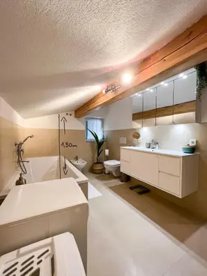 a bathroom with a sink and a tub and a toilet at Lovely,cosy Apartment 2 Min Skilift Walk in Campitello di Fassa