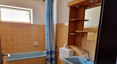 a bathroom with a sink and a mirror and a tub at Chalet Corallo con camino e ingresso indipendente in Ronco