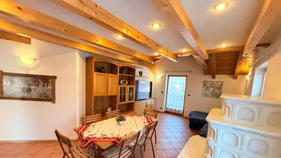 a dining room with a table and chairs at Casa mia - vall di fassa in Vigo di Fassa