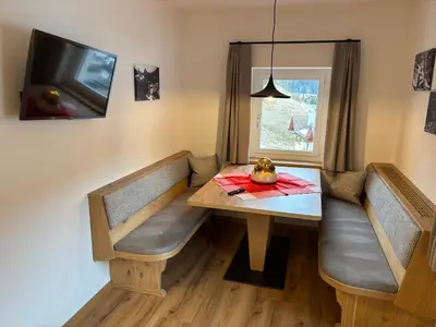 a dining room with a table and a window at Bed and Breakfast Iman in Santa Cristina in Val Gardena