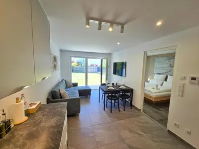 a living room with a couch and a table at Apartment Rosmarin - Alpstay in Naturno