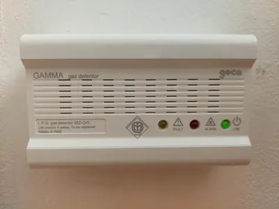 a white vent on a wall with a label at Appartamento-Wohnung Amblar in Cavareno