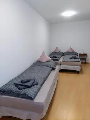 two twin beds in a room with at Appartamento-Wohnung Amblar in Cavareno
