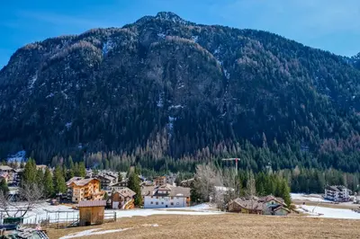 a town in front of a mountain at Casa Massari in Campitello di Fassa