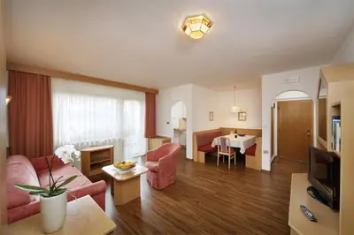 a living room with a couch and a table at Egger Apartments in Rifiano