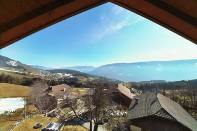 a view from a window of a house with mountains at Gasthof Hohenbichl in Terento
