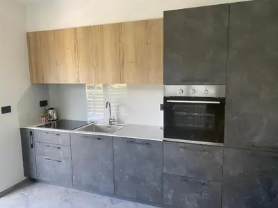 a kitchen with a sink and a stove at Guest House Cemin in Predazzo