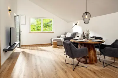 a living room with a table and a couch at Untermoserhof in Bolzano