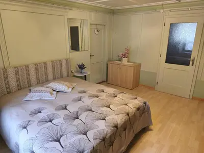 a bedroom with a large bed in a room at Casa Roberta in Falcade