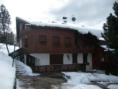 a house with snow on top of it at Mansarda in chalet a Cortina in Cortina dʼAmpezzo