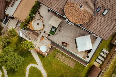 an overhead view of a yard with a pool and umbrella at Stella Due in Arabba