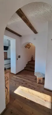 an empty room with a staircase in a building at La Dimora del Sole in Carano