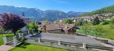 arial view of a house with mountains in the background at La Dimora del Sole in Carano