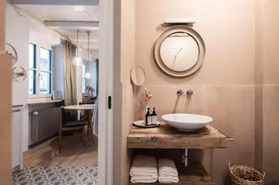 a bathroom with a shower and a toilet and a sink at Bogen bistro & apartments in Bolzano
