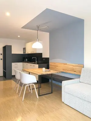 a kitchen with a dining table and a couch at Apartment Luis 2 - Alpstay in Naturno