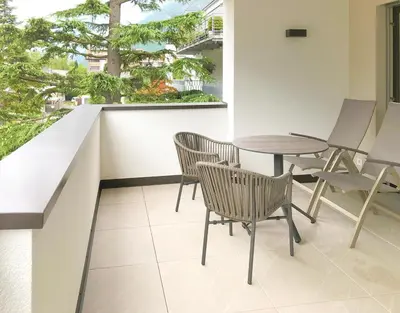 a balcony with a table and chairs and a window at Apartment Luis 2 - Alpstay in Naturno