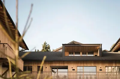 a house with a black roof at Wieserhof Family Farm in Maranza
