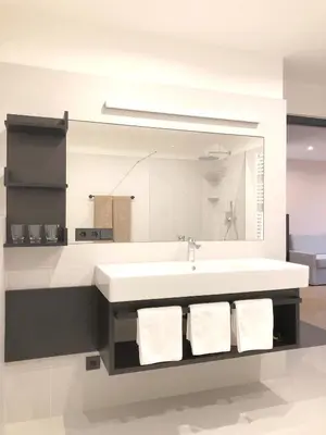 a bathroom with a white sink and a mirror at Apartment Luis 4 - Alpstay in Naturno