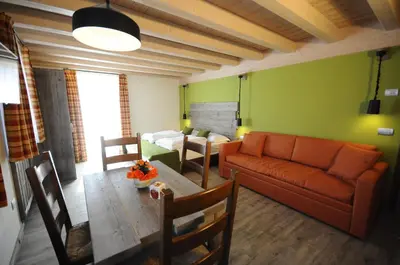 a living room with a couch and a table at Horse House in Romallo