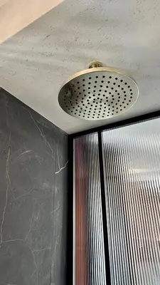 a iron grate on the side of a brick wall at VILLAREJA - Panorama Penthouse Suite mit Blick auf die Dolomiten in Bolzano