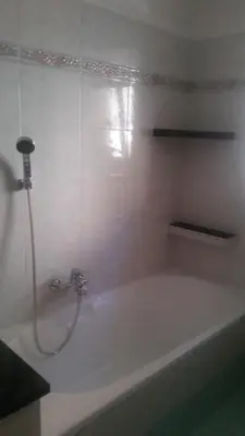 a bathroom with a bath tub with a shower at Casa Danoli in Canale San Bovo