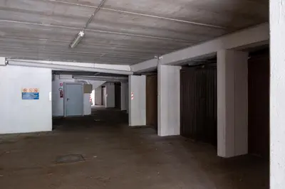 an empty hallway of an empty building with a door at Casa Lugli by go new location in Cavalese