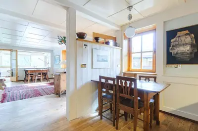 a kitchen and dining room with a table and chairs at Chalet Monciòn in Rualp