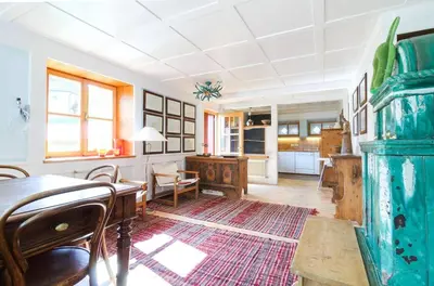 a living room with a table and a kitchen at Chalet Monciòn in Rualp