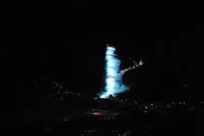 a lit up building with blue lights at night at Chalet Monciòn in Rualp