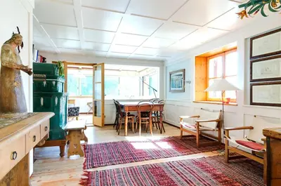 a living room with a table and chairs at Chalet Monciòn in Rualp